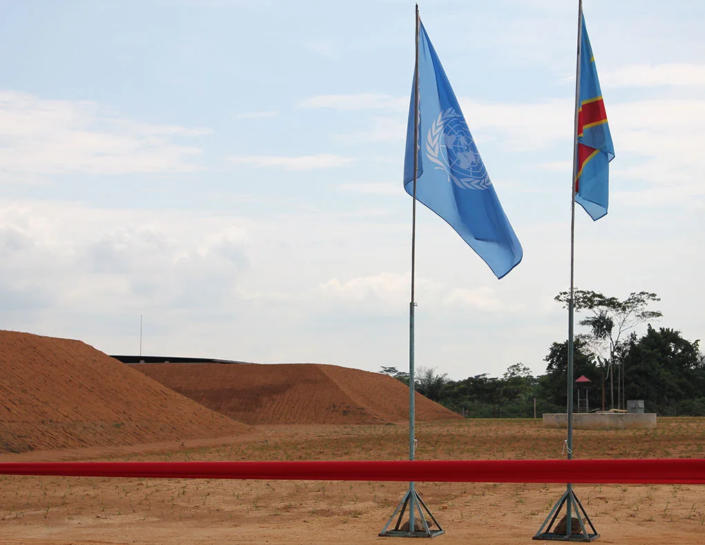 The DRC flag (right) beside the UN flag at an ammunition-depot ceremony in Kisangani, October 2013. MONUSCO published the photograph on November 15, 2013.