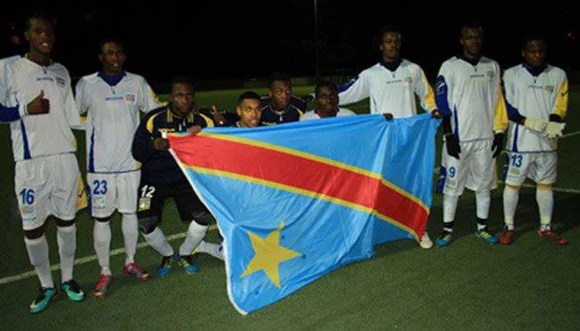 The DRC national soccer team holding the national flag in a photograph dated July 19, 2013.