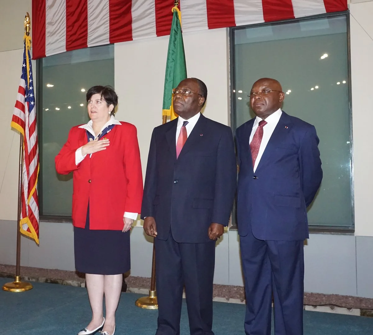 The Congolese flag behind Prime Minister Clément Mouamba at the U.S. independence anniversary celebration in Brazzaville on July 7, 2016, with Ambassador Stephanie Sullivan and Minister Raymond Mboulou.