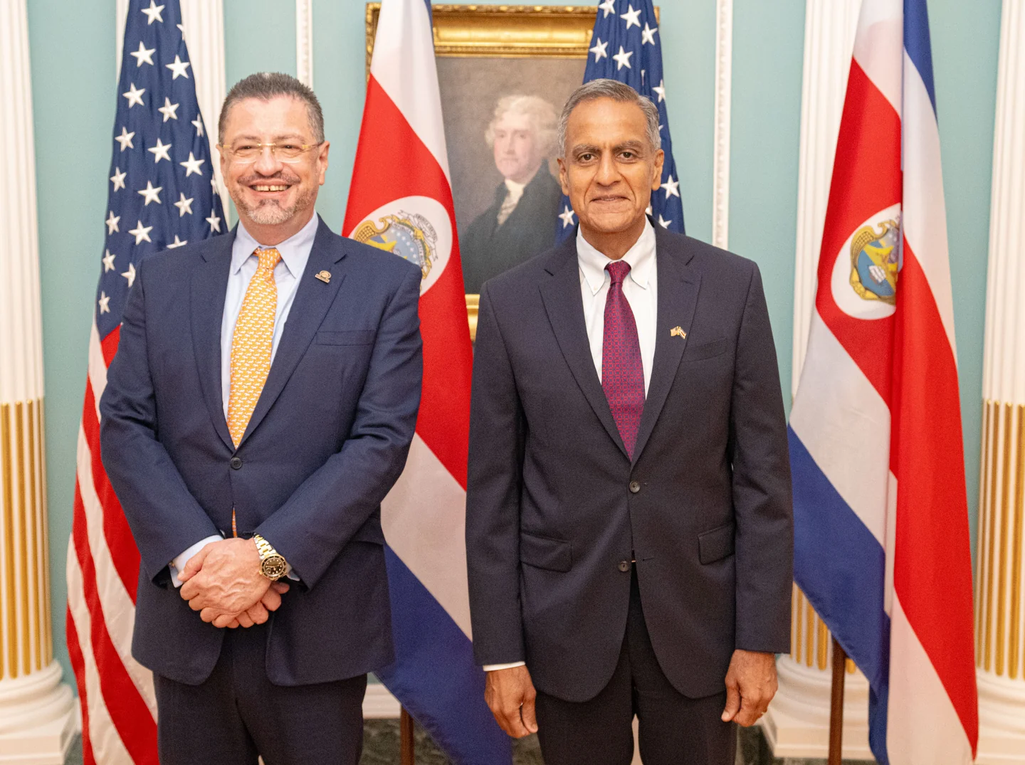 Costa Rican President Rodrigo Chaves, left, and U.S. Deputy Secretary Richard R. Verma at the State Department in Washington, DC, on August 30, 2023; Costa Rican pavilions and U.S. flags stand behind them.