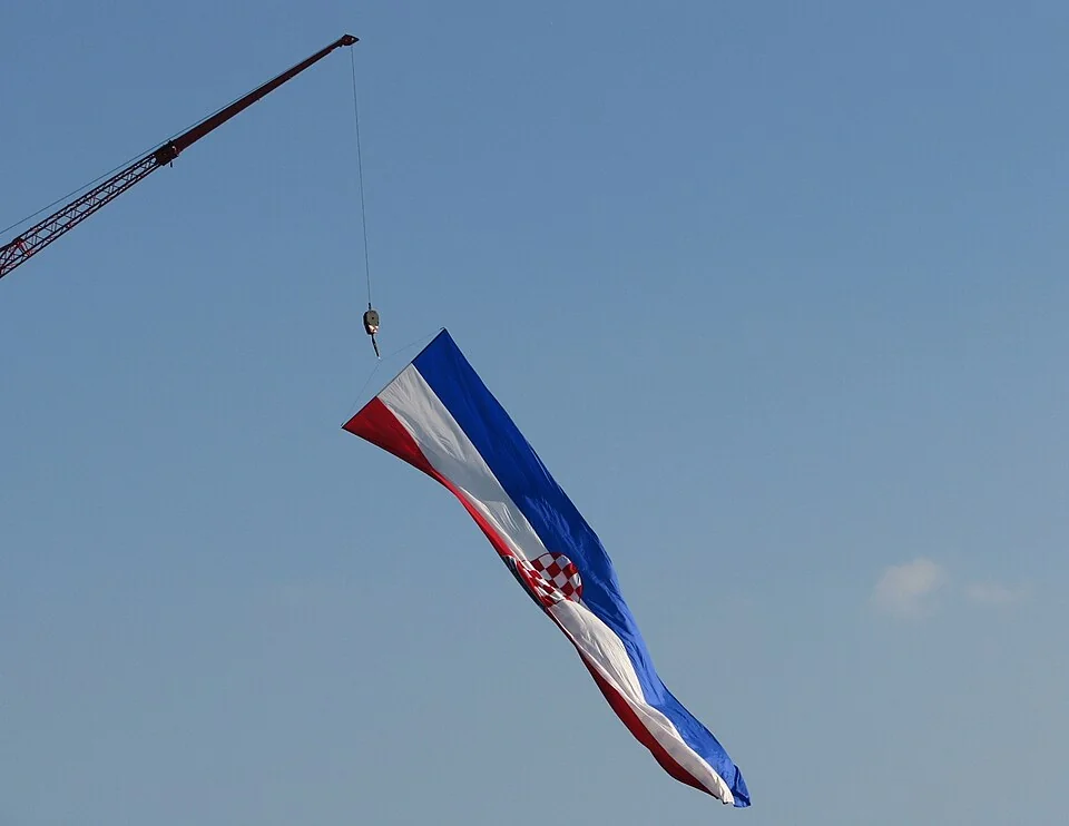 A Croatian flag suspended above the military parade in Zagreb on August 4, 2015.