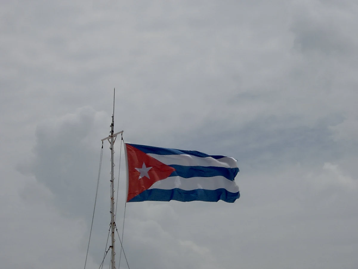 Cuba’s flag flies at El Morro castle in Havana, photographed by Angelo Lucia in August 2006.