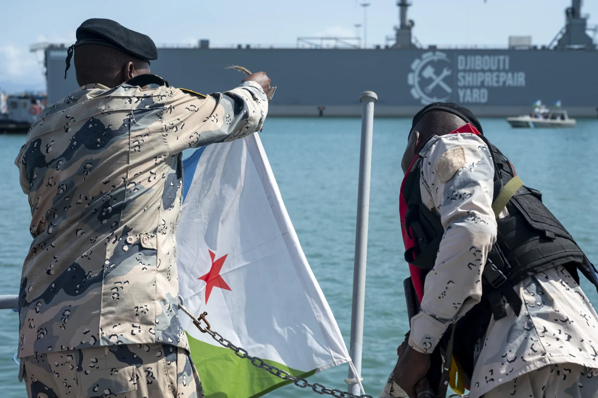 Uniformed personnel handling Djibouti’s flag during Exercise Bull Shark in Djibouti, May 5, 2024.