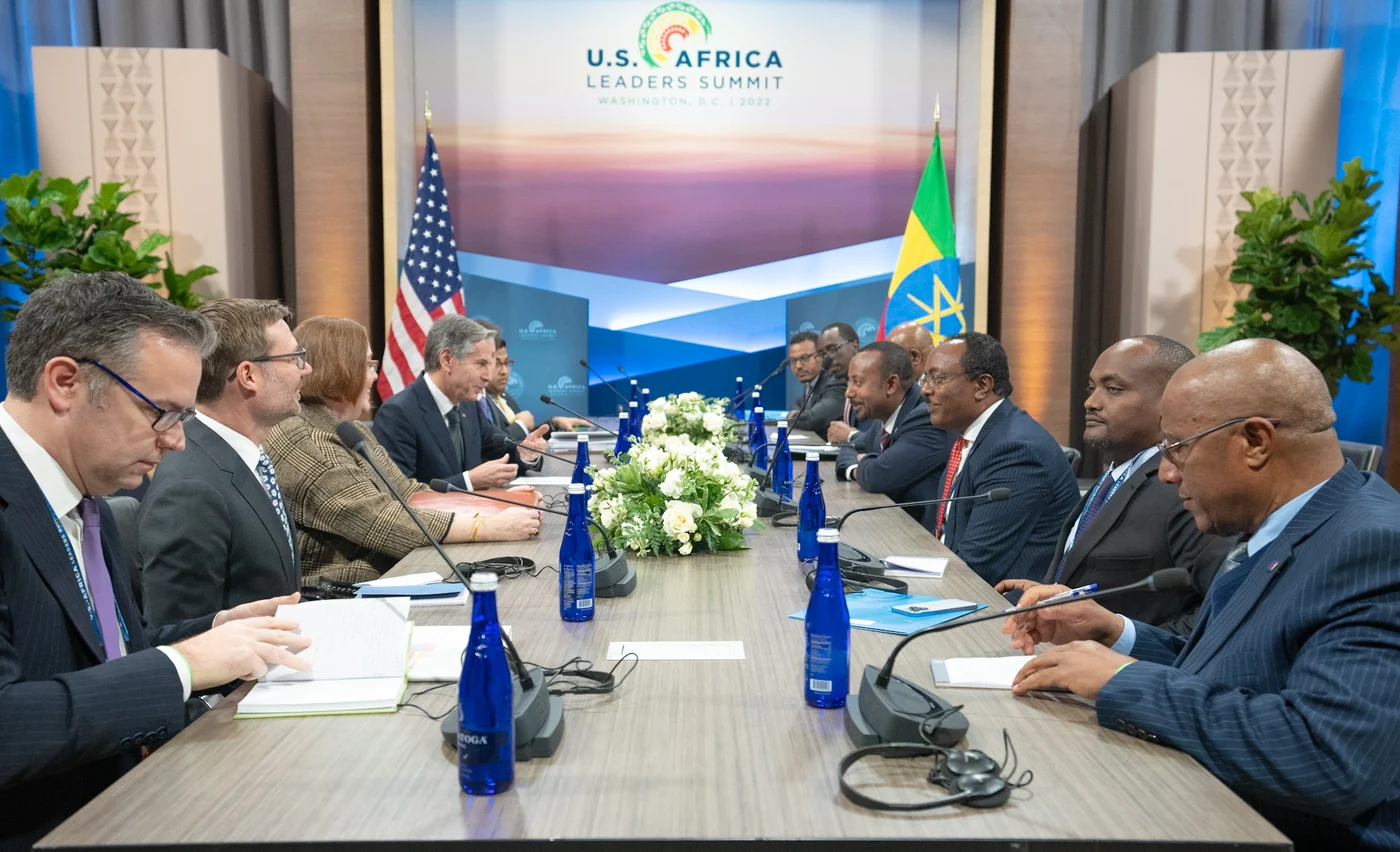 Ethiopian and U.S. flags at a meeting between Ethiopian Prime Minister Abiy Ahmed and U.S. Secretary of State Antony J. Blinken in Washington, D.C., on December 13, 2022. This historical photograph shows ceremonial use, not calibrated flag colors.
