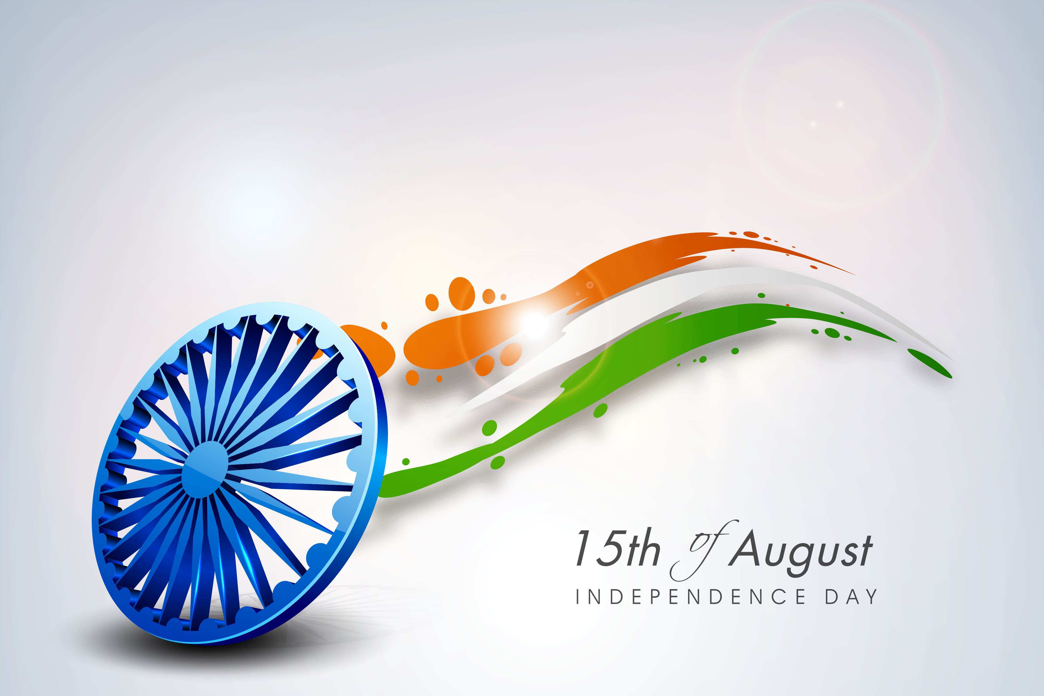 A three-dimensional blue Ashoka Chakra wheel standing upright with a tricolour splash, and the words 15th of August, Independence Day
