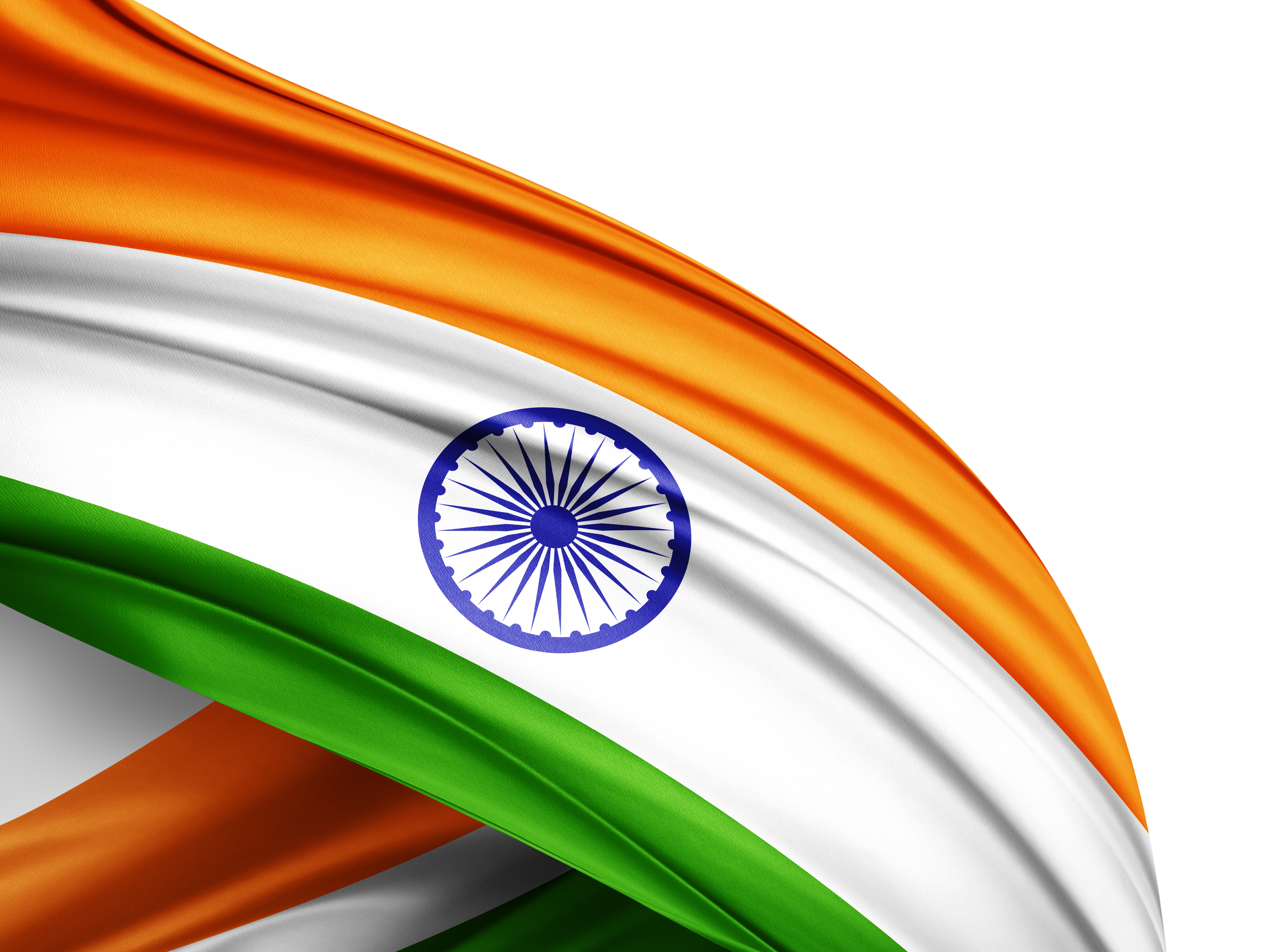 Close-up of the Indian flag in rich satin fabric, folds of saffron, white and green with the navy Ashoka Chakra