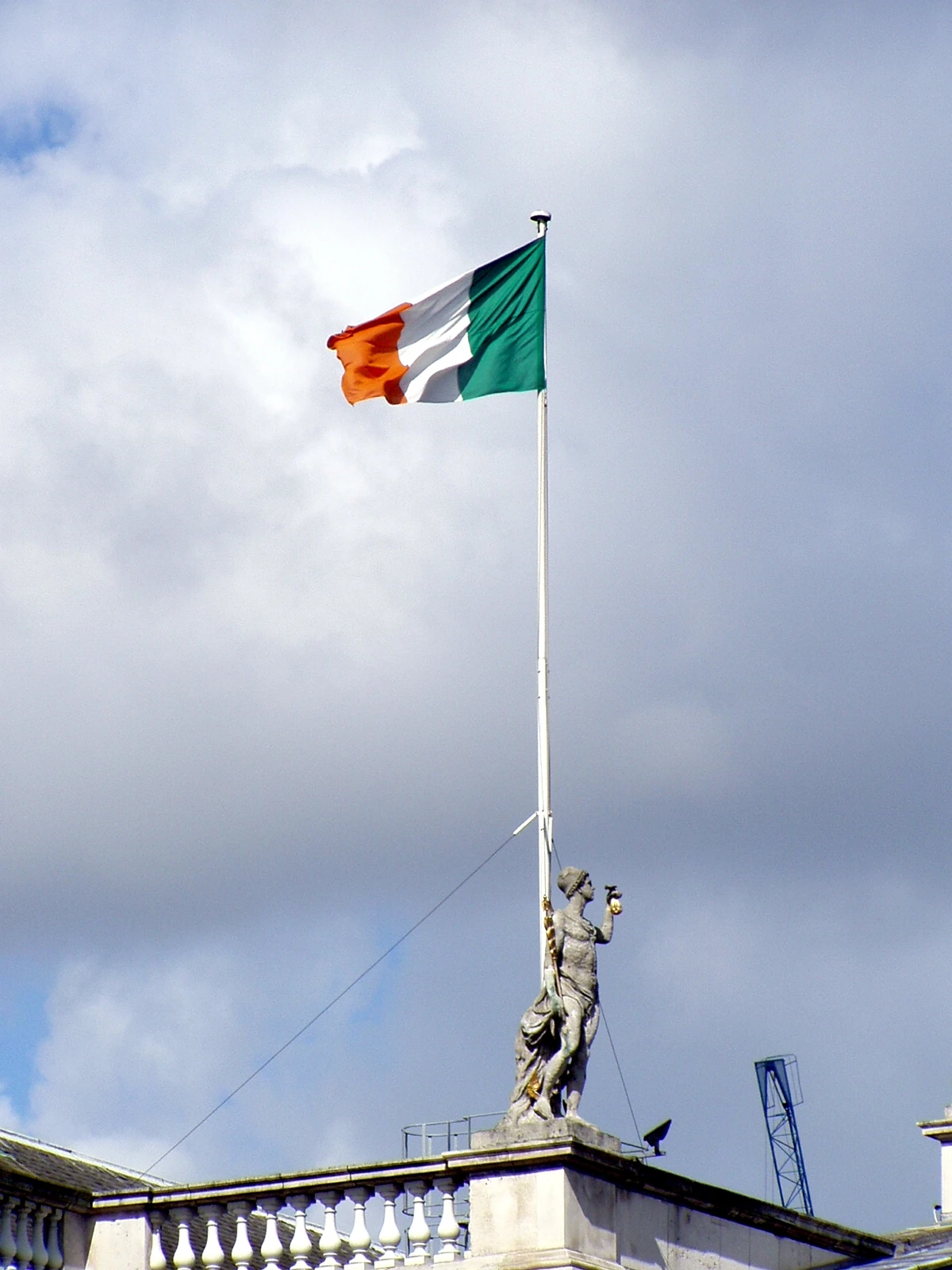 The Irish tricolor flies above the General Post Office in Dublin in August 2003. The staff is on the right of the cloth in this reverse view; green remains next to it.