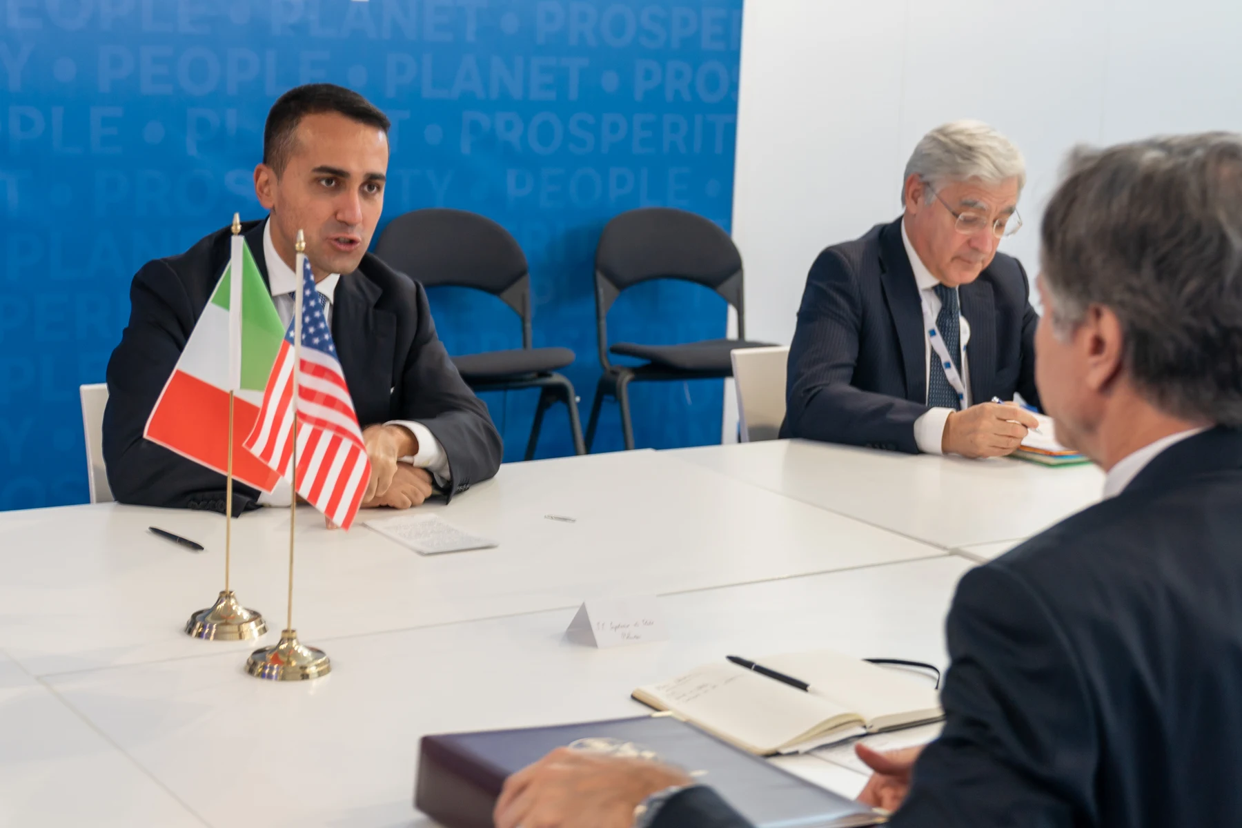 Italian and U.S. desk flags appear at Antony Blinken’s meeting with Luigi Di Maio in Rome on October 30, 2021.